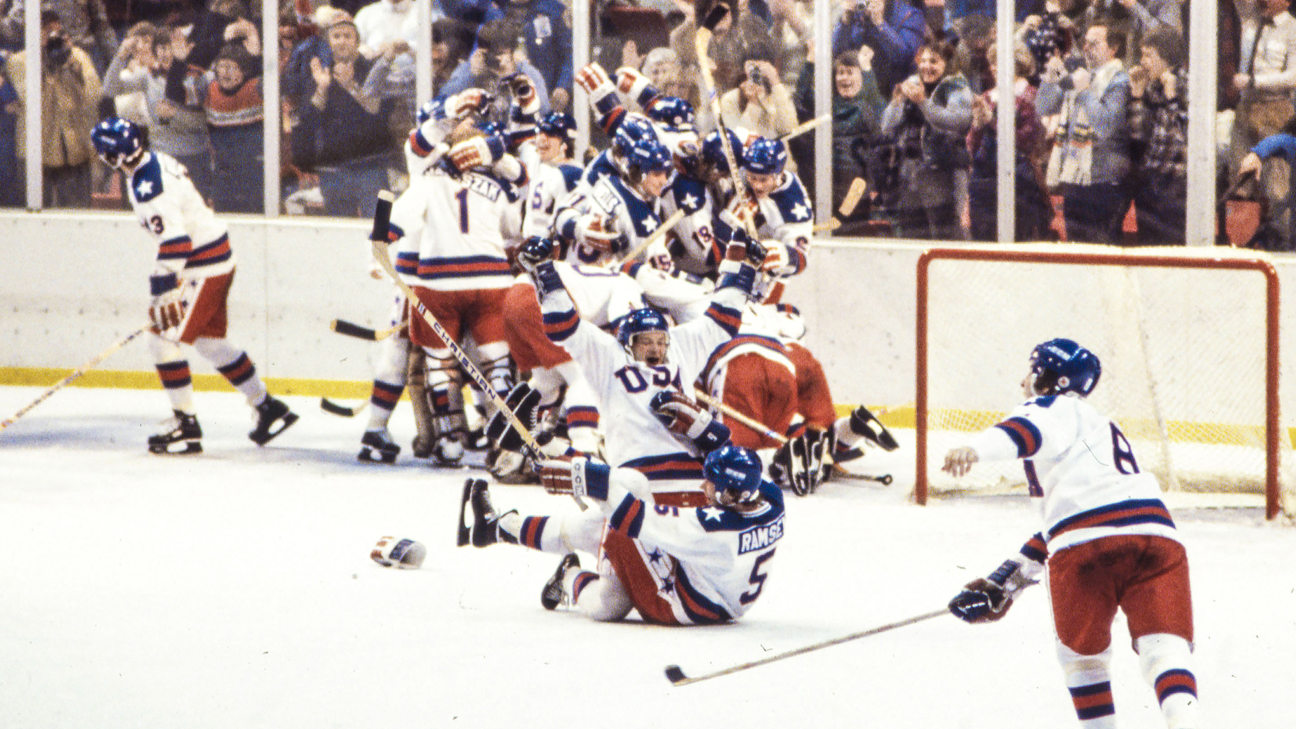 The 1980 U.S. Olympic hockey team celebrating in a pile on the ice after beating the Soviet Union.