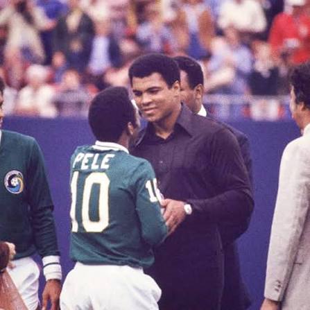 Pelé being carried on teammates' shoulders after a World Cup win, holding a Brazilian flag.